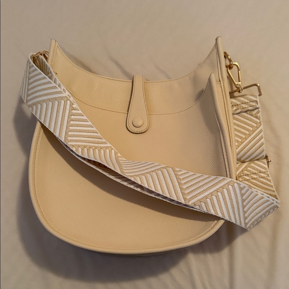 Stylish Cream Crossbody Bag with Patterned Strap